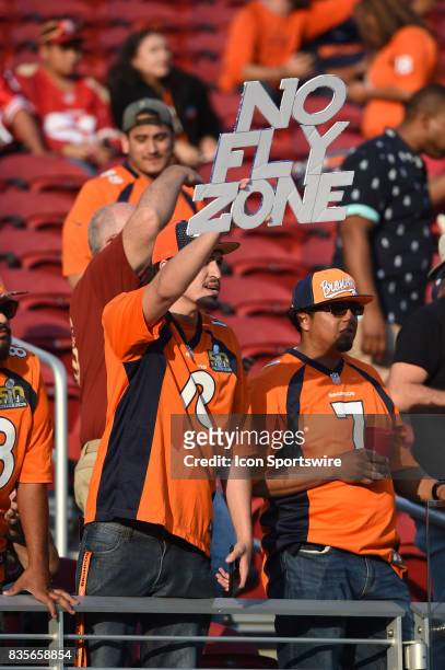 Broncos fan holds up a No Fly Zone sign during pregame warmups prior to an NFL preseason game between the Denver Broncos and the San Francisco 49ers...