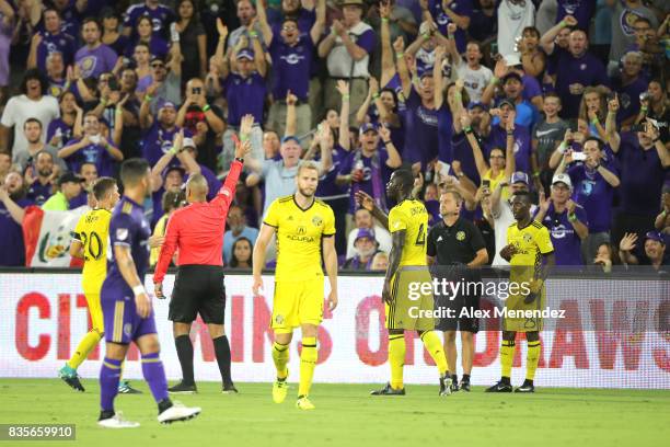 Referee Juan Guzman Jr. Calls a red card on Harrison Afful of Columbus Crew SC after looking at a video review during a MLS soccer match between the...