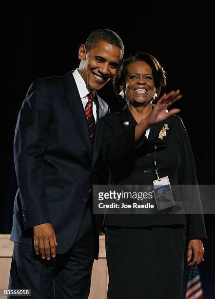 President elect Barack Obama stands on stage with his mother-in-law Marian Robinson during an election night gathering in Grant Park on November 4,...