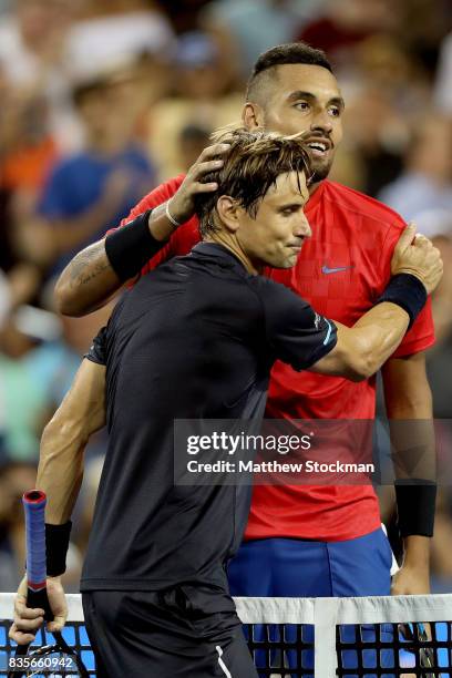 David Ferrer of Spain congratulates Nick Kyrgiuos of Australia after their match during day 8 of the Western & Southern Open at the Lindner Family...