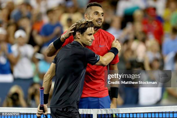 David Ferrer of Spain congratulates Nick Kyrgiuos of Australia after their match during day 8 of the Western & Southern Open at the Lindner Family...