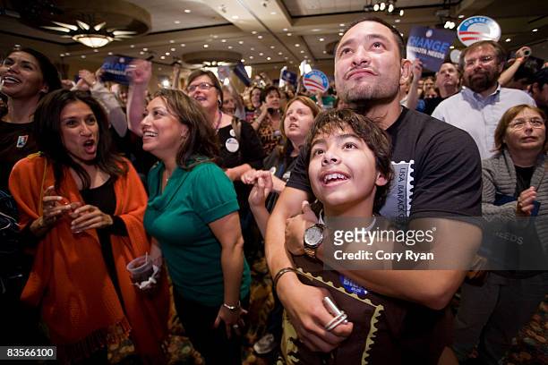 David Albornoz embraces his son Carlos Albornoz after the announcement of Barack Obama as President during the DFL gathering on November 4, 2008 at...