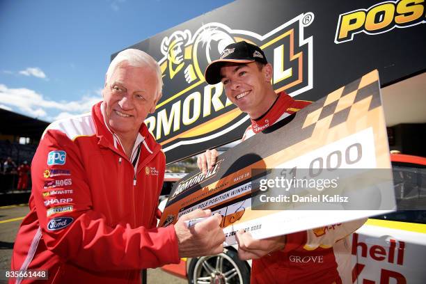 Dick Johnson team owner and Scott McLaughlin driver of the Shell V-Power Racing Team Ford Falcon FGX pose for a photo after qualifying for race 18 of...