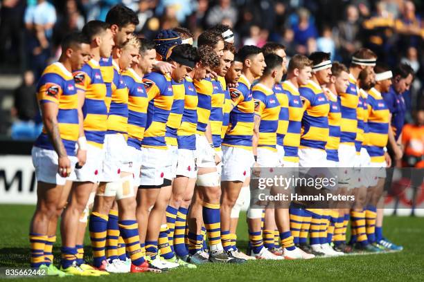 Bay of Plenty stand in silence to acknowledge the passing of Former All Blacks player, Sir Colin Meads during the round one Mite 10 Cup match between...