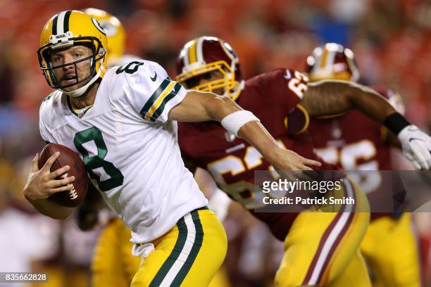 Quarterback Taysom Hill of the Green Bay Packers rushes for a touchdown against the Washington Redskins in the fourth quarter during a preseason game...
