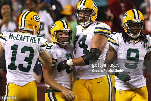 Quarterback Taysom Hill of the Green Bay Packers celebrates after rushing for a touchdown against the Washington Redskins in the fourth quarter...