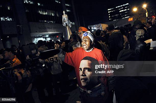 People celebrate on Adam Clayton Powell JR Boulevard in Harlem, New York City after US Senator Barack Obama became President Elect November 04, 2008....