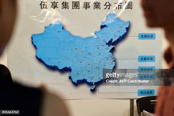 This photo taken on July 1, 2017 shows visitors looking at a map of China during a jobs fair in Taipei. Taiwan has long seen its international allies...