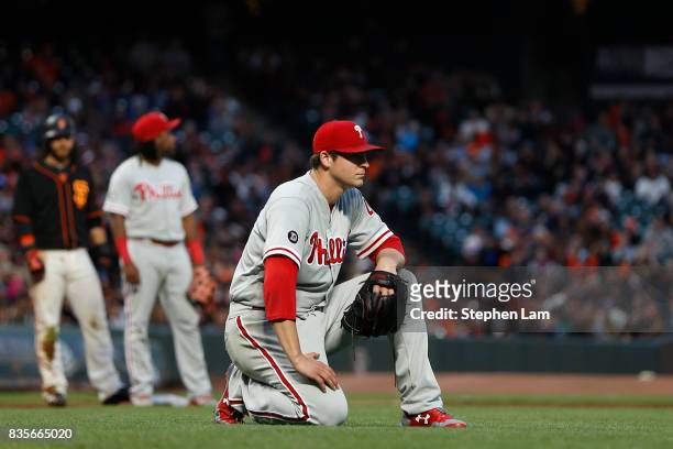 Jerad Eickhoff of the Philadelphia Phillies reacts after a bunt single by Ty Blach of the San Francisco Giants during the fourth inning at AT&T Park...