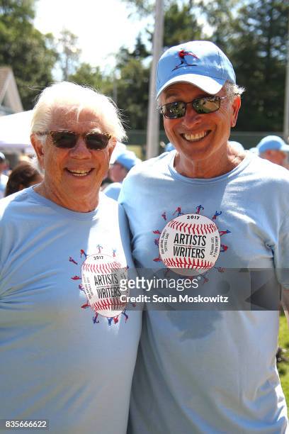 Carl Bernstein and Ken Auletta attend the 69th Annual Artists and Writers Softball Game at Herrick Park on August 19, 2017 in East Hampton, New York.