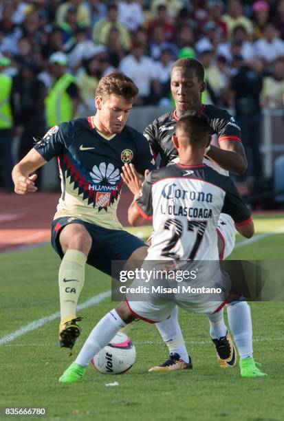 Alejandro Diaz of America, fights for the ball Eduardo Tercero of Lobos BUAP during the fifth round match between Lobos BUAP and America as part of...