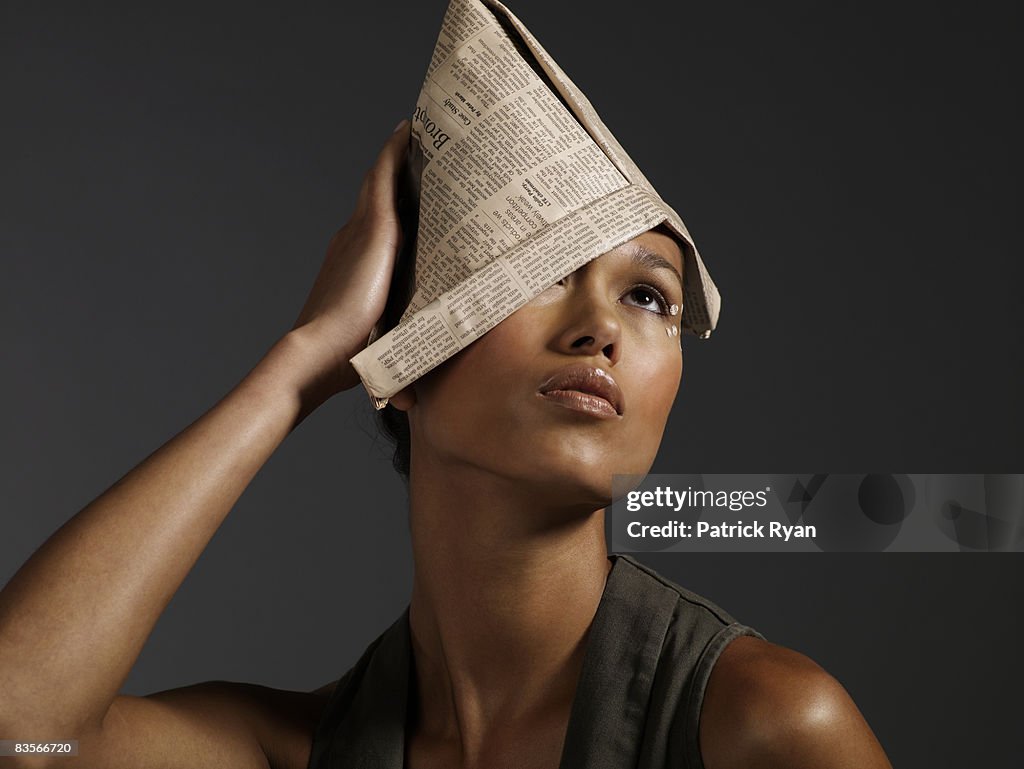 Woman with Newspaper Hat