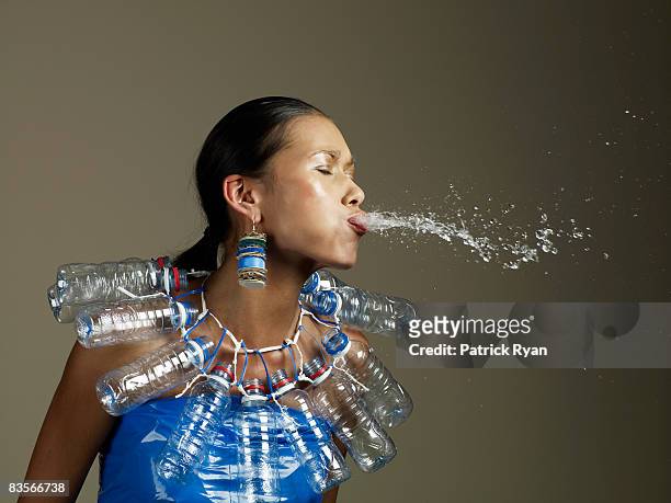 woman in water outift spitting - spit stock pictures, royalty-free photos & images