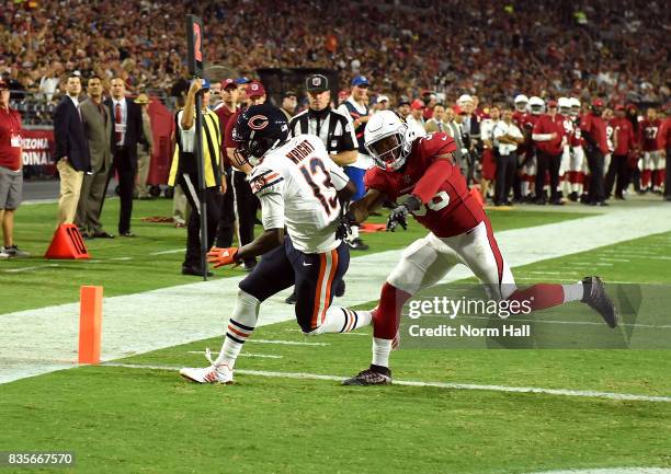 Kendall Wright of the Chicago Bears catches a touchdown pass during the first half while being defended by Budda Baker of the Arizona Cardinals at...