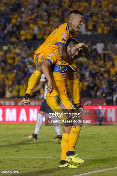 Andre Gignac of Tigres celebrates with teammate Eduardo Vargas after scoring his team's second goal during the 5th round match between Tigres and...
