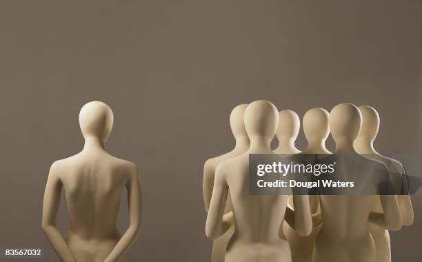 single clone next to group. - mannequins stock pictures, royalty-free photos & images