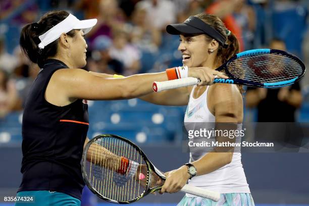 Yung-Jan Chan of Taipei and Martina Hingis of Switzerland celebrate match point against Su-Wei Hsieh of Taipei and Monica Niculescu of Romania in the...