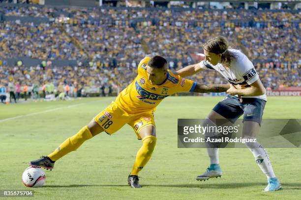 Ismael Sosa of Tigres fights for the ball with Jose Garcia of Pumas during the 5th round match between Tigres and Pumas as part of the Torneo...