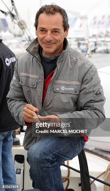 French skipper Marc Guillemot, poses on board of his 60-feet-long "Safran" monohull on November 5, 2008 at Les Sables-d'Olonne's harbour, western...