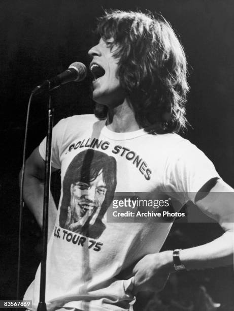 Mick Jagger, lead singer for the British rock group The Rolling Stones, performs in one of the band's concert T-shirts, circa 1975.