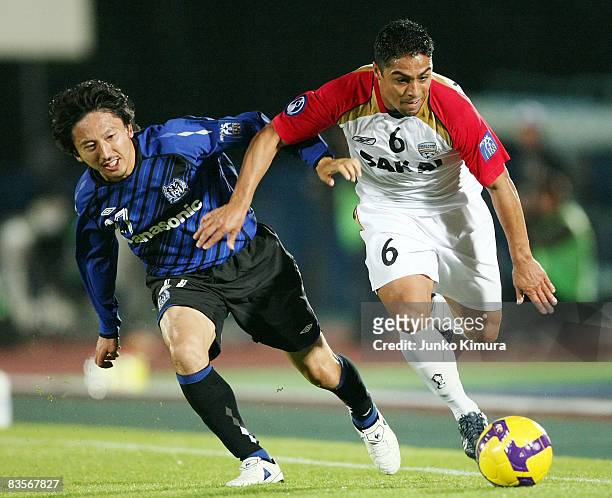 Hideo Hashimoto of Gamba Osaka and Cassio of Adelaide United battle for the ball during the AFC Champions League Final first leg match between Gamba...