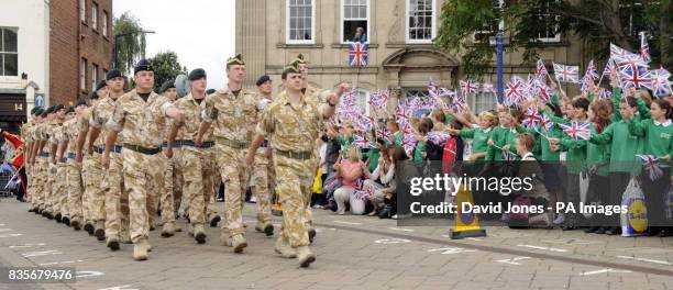 The Queen's Royal Hussars march through Warwick on their homecoming parade today.