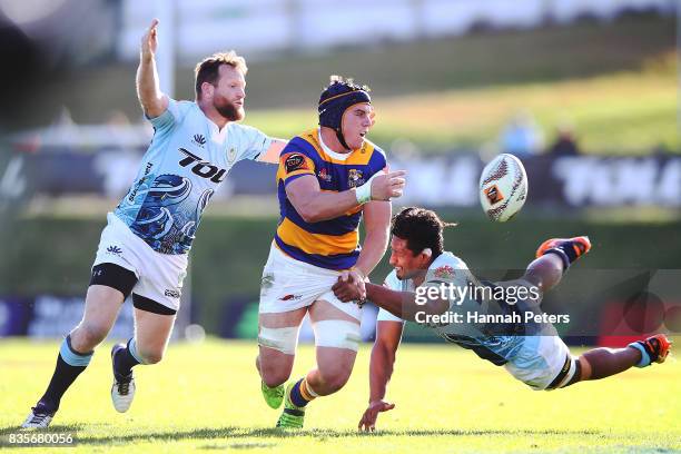 Hugh Blake of Bay of Plenty offloads the ball during the round one Mite 10 Cup match between Northland and Bay of Plenty at Toll Stadium on August...