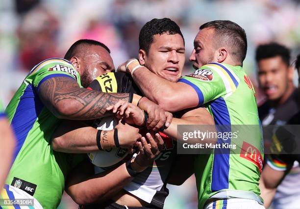 Dallin Watene Zelezniak of the Panthers is tackled during the round 24 NRL match between the Canberra Raiders and the Penrith Panthers at GIO Stadium...