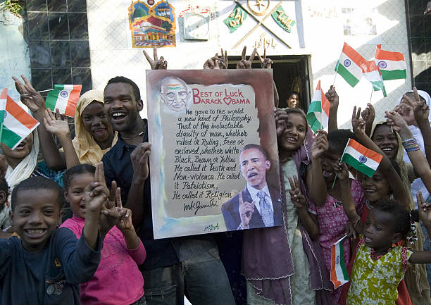 indian-siddi-tribals-hold-posters-of-us-president-elect-barack-obama-and-indian-national-flags.jpg
