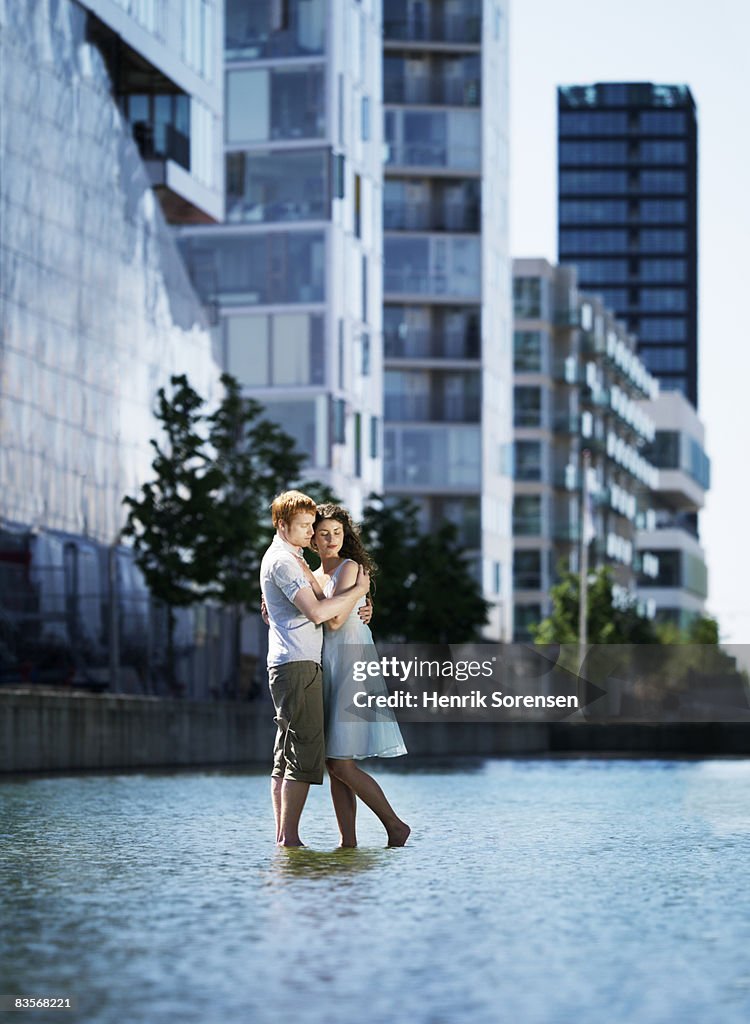 Couple standing on the water embracing