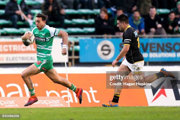 Ambrose Curtis of Manawatu breaks away from Jackson Garden-Bachop of Wellington during the round one Mitre 10 Cup match between Manawatu and...