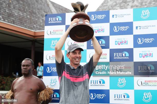 Jason Norris of Australia celebrates with his trophy after winning on day four of the 2017 Fiji International at Natadola Bay Championship Golf...