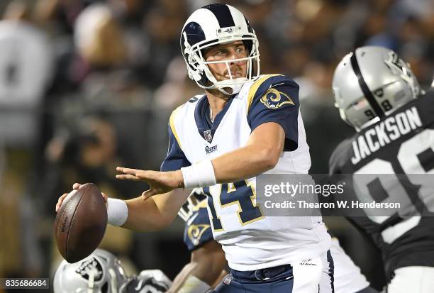 Sean Mannion of the Los Angeles Rams drops back to pass against the Oakland Raiders during the fourth quarter of their preseason NFL football game at...