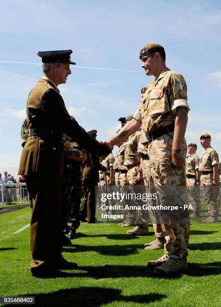 Territorial Army soldiers from the 4th Battalion The Yorkshire Regiment are presented with their Afghanistan Service Medals by the Regiment's...