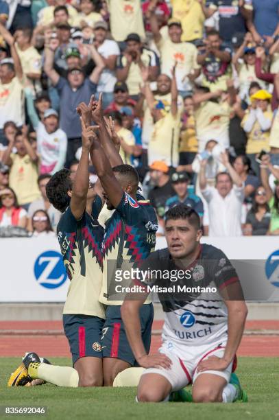 William da Silva of America celebrates with teammate Cecilio Dominguez after scoring the first goal of his team during the fifth round match between...