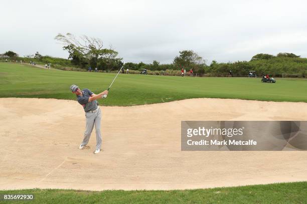 Jason Norris of Australia plays a bunker shot on the 10th hole during the 2017 Fiji International at Natadola Bay Championship Golf Course on August...
