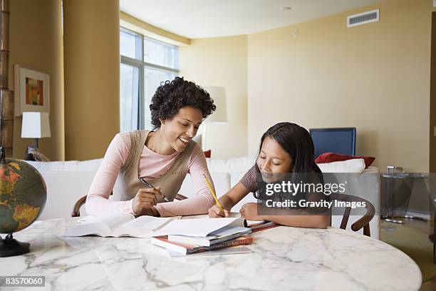 hip mum and daughter - globe showing north america stock pictures, royalty-free photos & images