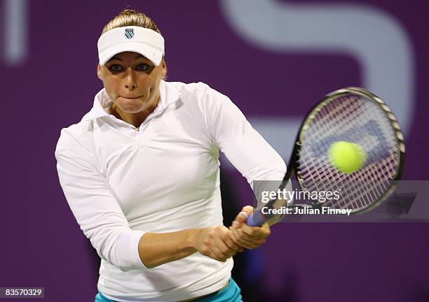 Vera Zvonareva of Russia plays a backhand in her match against Ana Ivanovic of Serbia during the Sony Ericsson Championships at the Khalifa Tennis...
