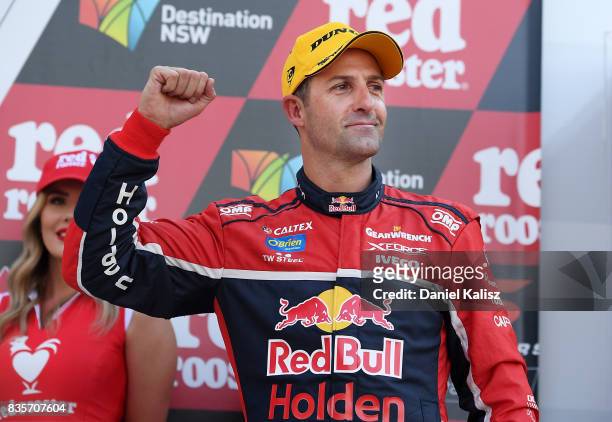 Jamie Whincup driver of the Red Bull Holden Racing Team Holden Commodore VF celebrates after winning race 18 for the Sydney SuperSprint, which is...