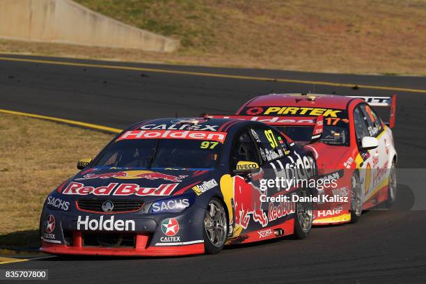 Shane Van Gisbergen drives the Red Bull Holden Racing Team Holden Commodore VF leads Scott McLaughlin drives the Shell V-Power Racing Team Ford...