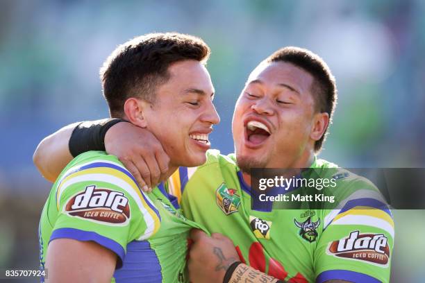 Joseph Tapine of the Raiders celebrates with Joseph Leilua after scoring a try during the round 24 NRL match between the Canberra Raiders and the...