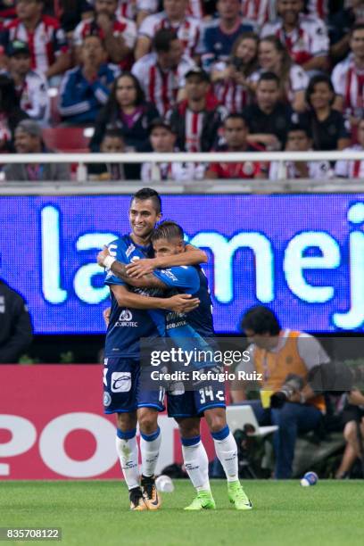 Alfonso Zamora of Puebla celebrates with teammates after scoring the first goal of his team during the fifth round match between Chivas and Puebla as...