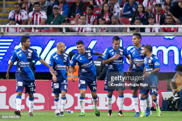 Alfonso Zamora of Puebla celebrates with teammates after scoring the first goal of his team during the fifth round match between Chivas and Puebla as...