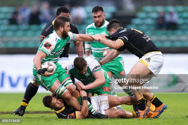 Heiden Bedwell-Curtis captain of Manawatu fends Jackson Garden-Bachop of Wellington during the round one Mitre 10 Cup match between Manawatu and...