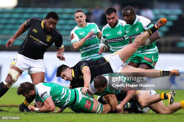 Heiden Bedwell-Curtis of Manawatu is tackled by Jackson Garden-Bachop of Wellington during the round one Mitre 10 Cup match between Manawatu and...