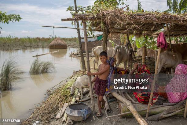 Villagers are sitting in a safe place in a flood affected village of Gaibandha, Bangladesh. August 19, 2017. Gaibandha is a district in Northern...