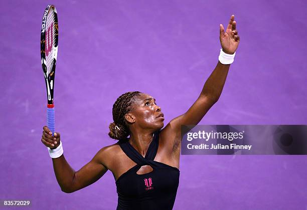 Venus Williams of United States serves to Elena Dementieva of Russia during the Sony Ericsson Championships at the Khalifa Tennis Complex on November...