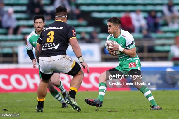 Otere Black of Manawatu looks to beat the challenge of Alex Fidow of Wellington during the round one Mitre 10 Cup match between Manawatu and...