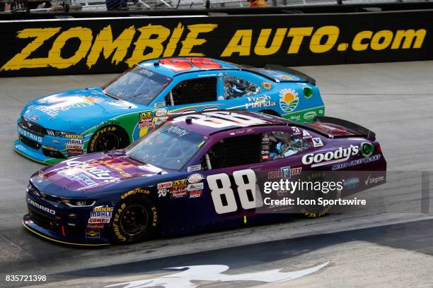 Dale Earnhardt jr and Aric Alimarola during the running of the 36th annual Food City 300 Xfinity race at Bristol Motor Speedway on August 18,2017