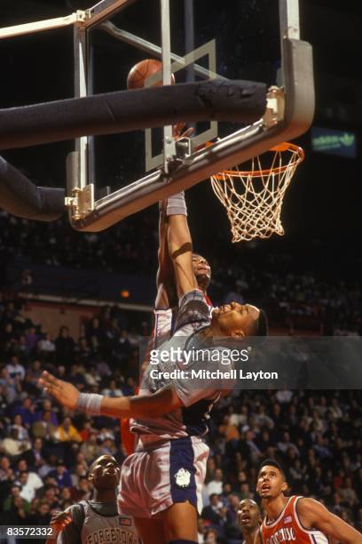 Alonzo Mourning of the Georegtoen Hoyas blocks a shot during a college basketball game against the Syracuse Orangeman at Capitol Centre on March 6,...